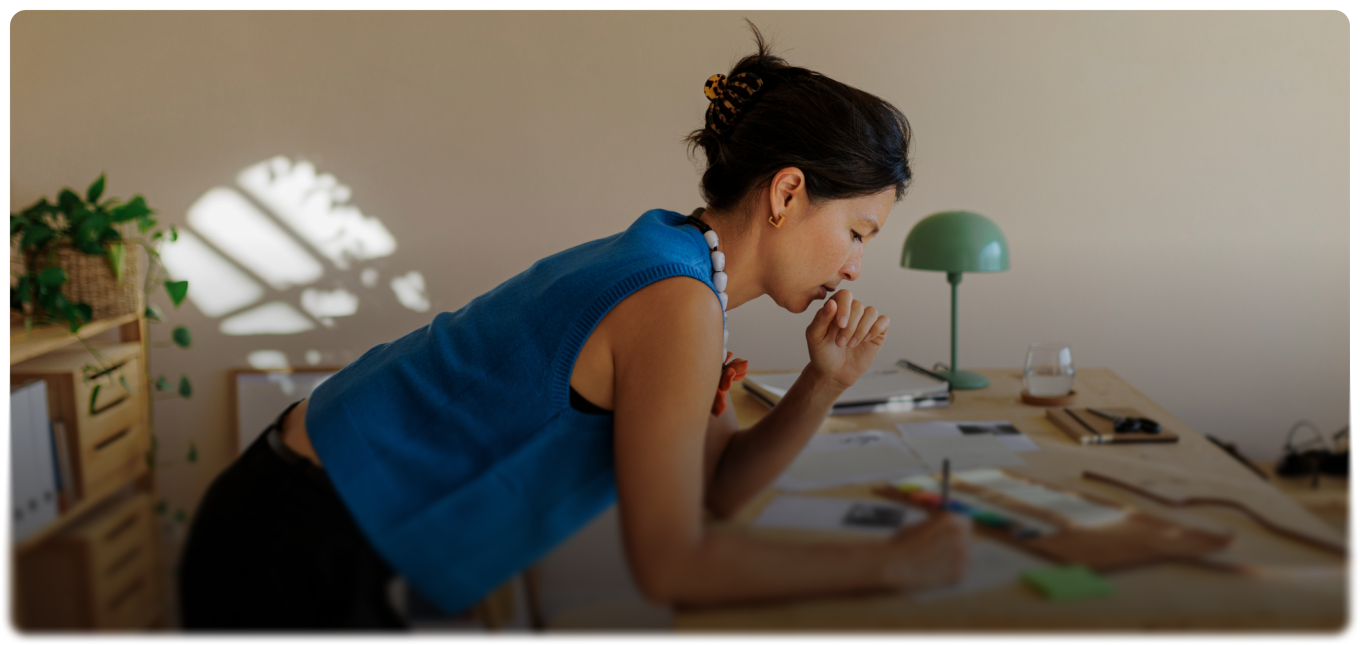 Business owner in a blue shirt working at a desk